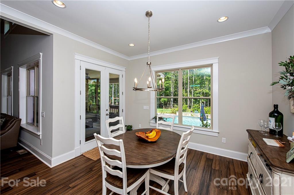 1286 Trinity Ridge Parkway Fort Mill, SC 29715 - Photo 24 of 48 a view of a dining room with furniture window and wooden floor