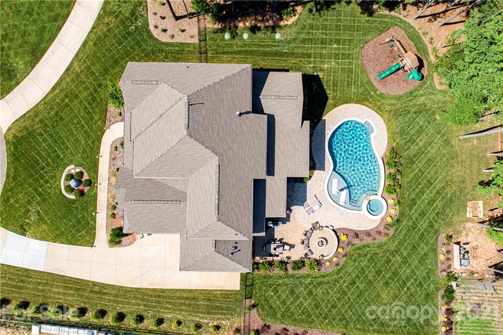1286 Trinity Ridge Parkway Fort Mill, SC 29715 - Photo 4 of 48 an aerial view of a house with outdoor space and that has a swimming pool