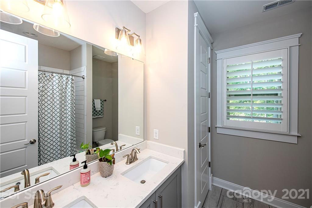 1286 Trinity Ridge Parkway Fort Mill, SC 29715 - Photo 31 of 48 a bathroom with a sink vanity granite and a mirror
