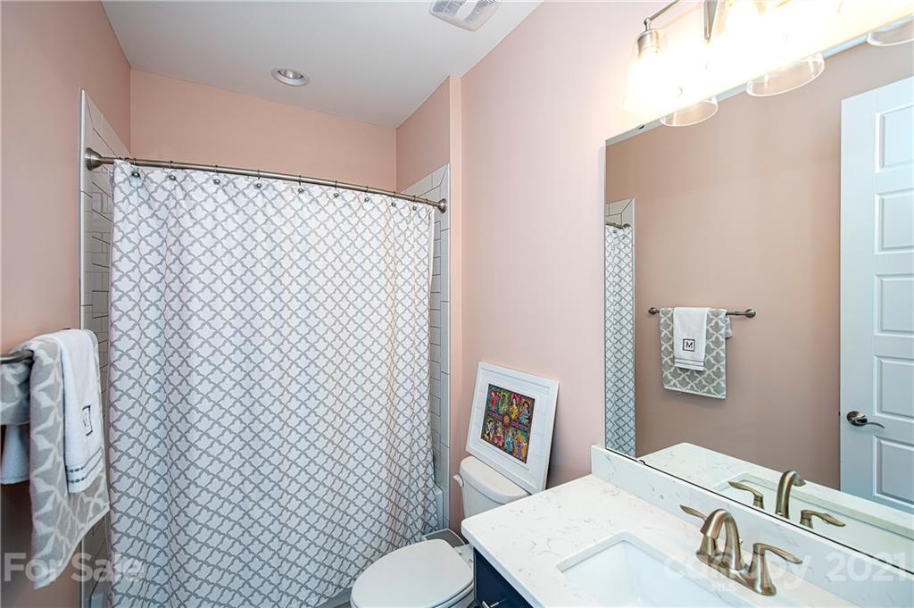 1286 Trinity Ridge Parkway Fort Mill, SC 29715 - Photo 35 of 48 a bathroom with a sink a toilet and shower curtain