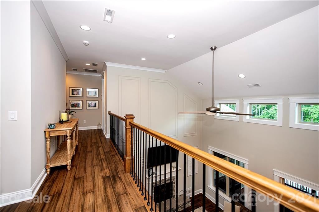1286 Trinity Ridge Parkway Fort Mill, SC 29715 - Photo 38 of 48 a view of a hallway with wooden floor and staircase