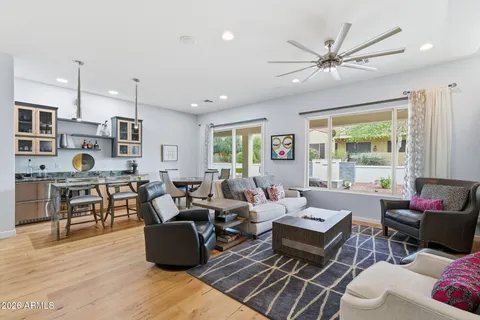 a living room with furniture and a large window