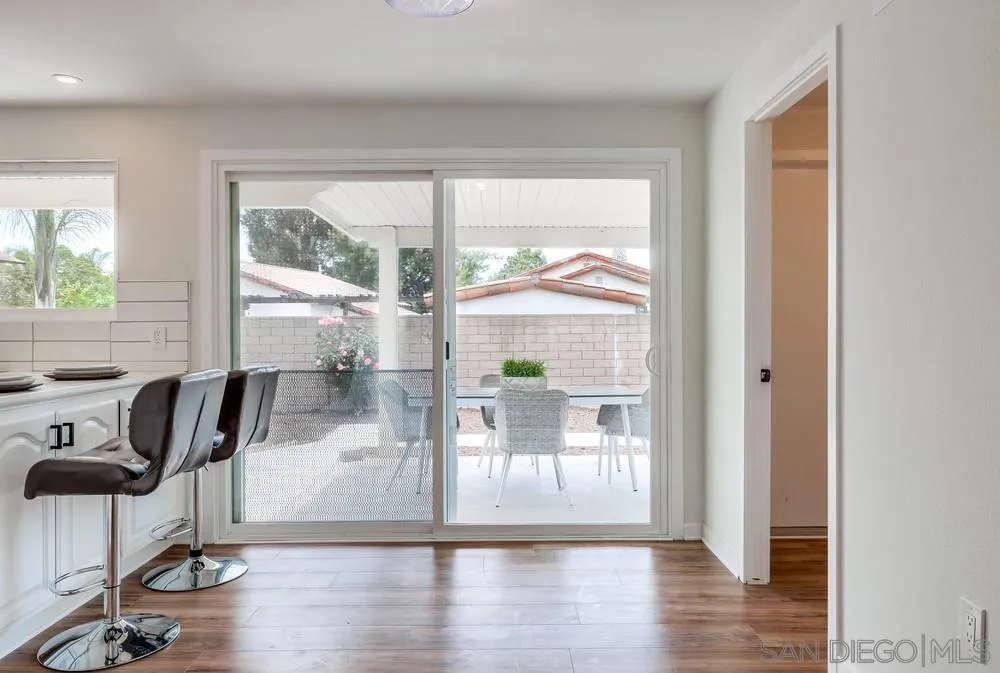 13362 Carriage Road Poway, CA 92064 - Photo 17 of 39 a view of a livingroom with wooden floor and a glass door