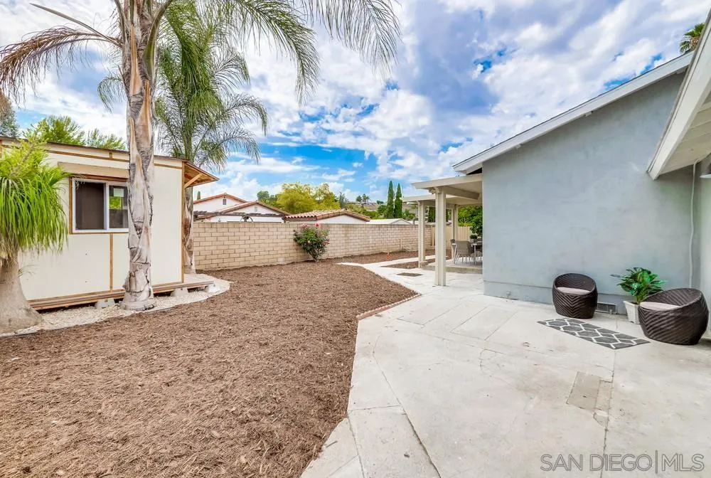 13362 Carriage Road Poway, CA 92064 - Photo 34 of 39 a view of a backyard with plants and a patio