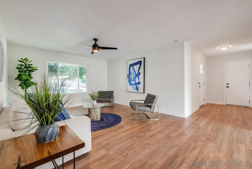 13362 Carriage Road Poway, CA 92064 - Photo 9 of 39 a living room with furniture and a potted plant