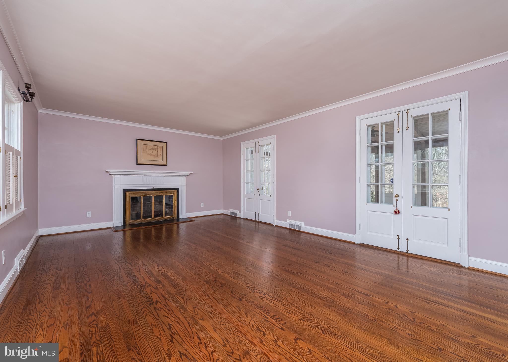 209 Patuxent Road Laurel, MD 20707 - Photo 6 of 26 Living room with french doors to screened porch