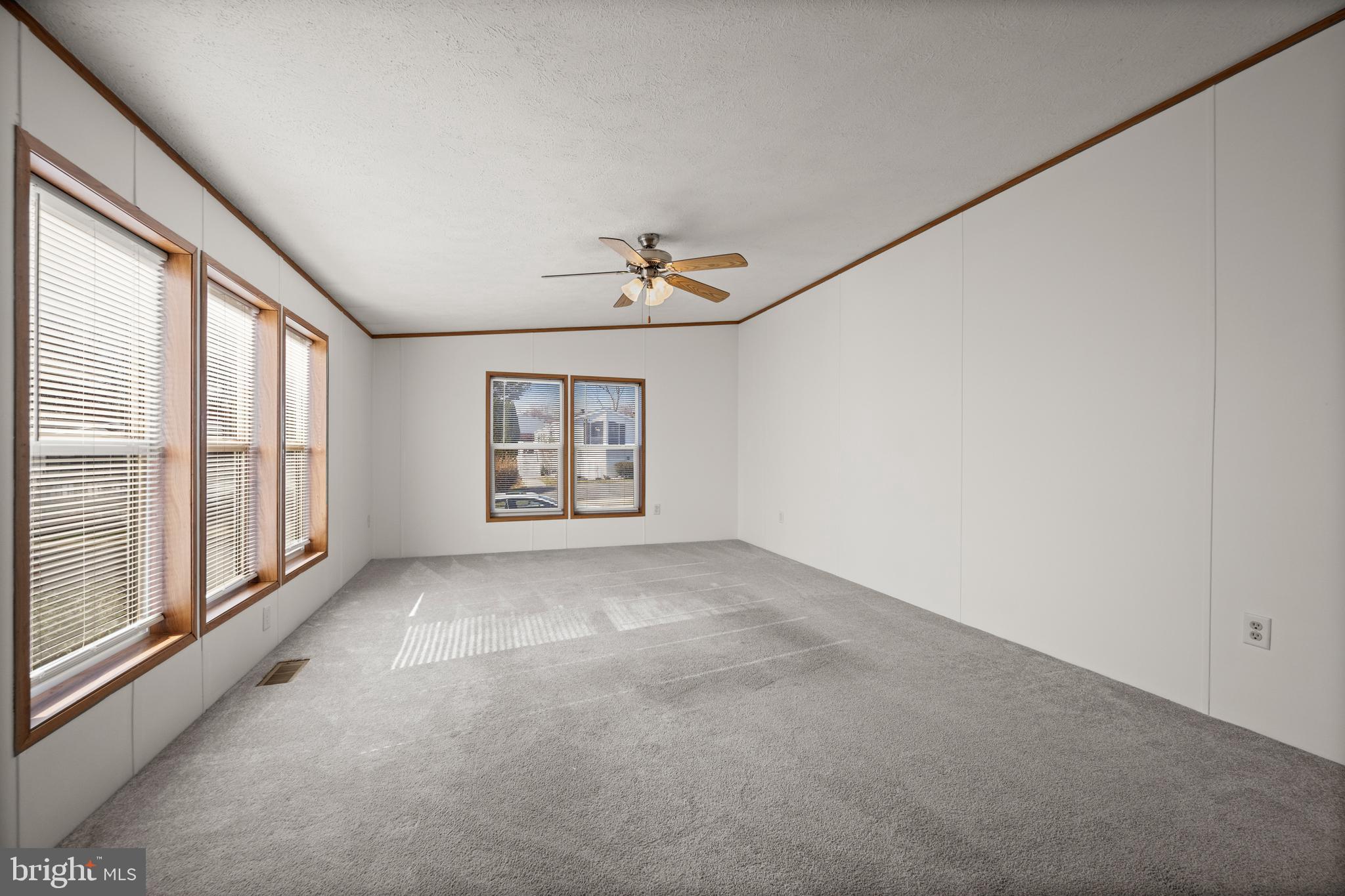 8408 Heartwood Road Jessup, MD 20794 - Photo 15 of 32 a view of a livingroom with a ceiling fan and window