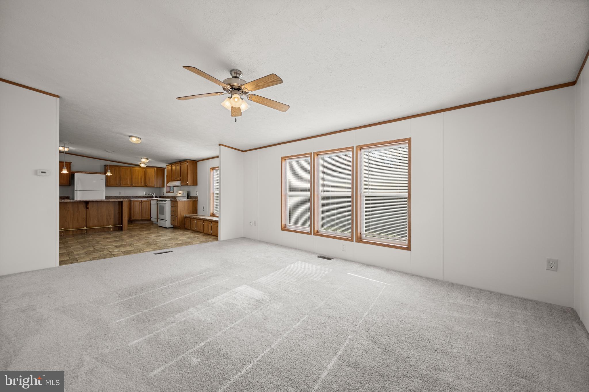 8408 Heartwood Road Jessup, MD 20794 - Photo 16 of 32 a view of a livingroom with furniture and a ceiling fan