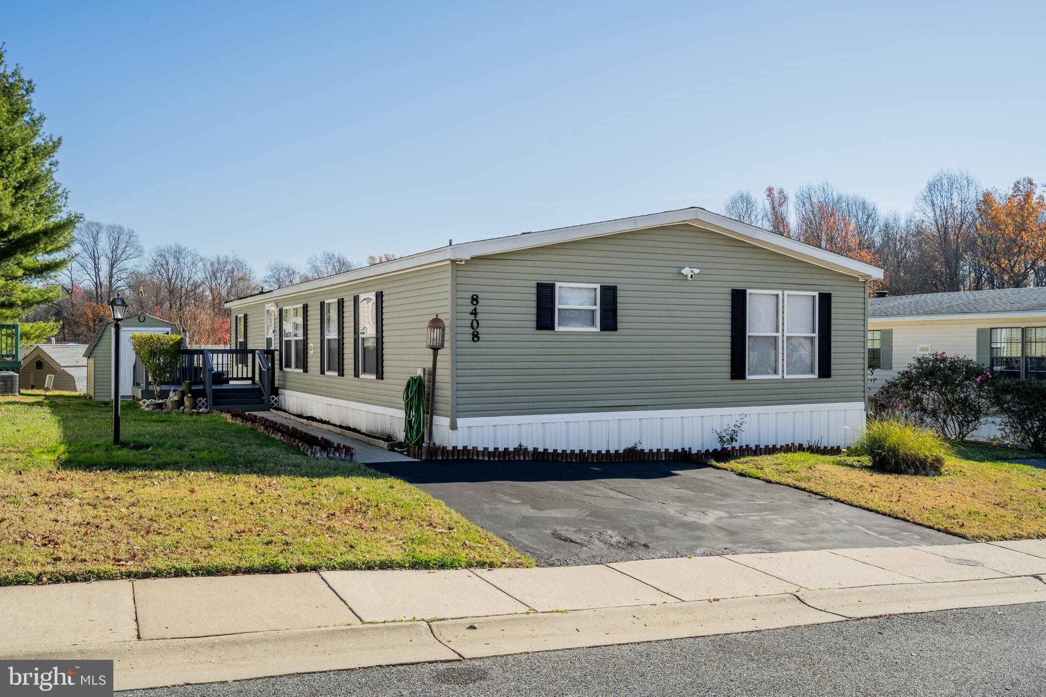 8408 Heartwood Road Jessup, MD 20794 - Photo 2 of 32 a front view of a house with a yard and garage