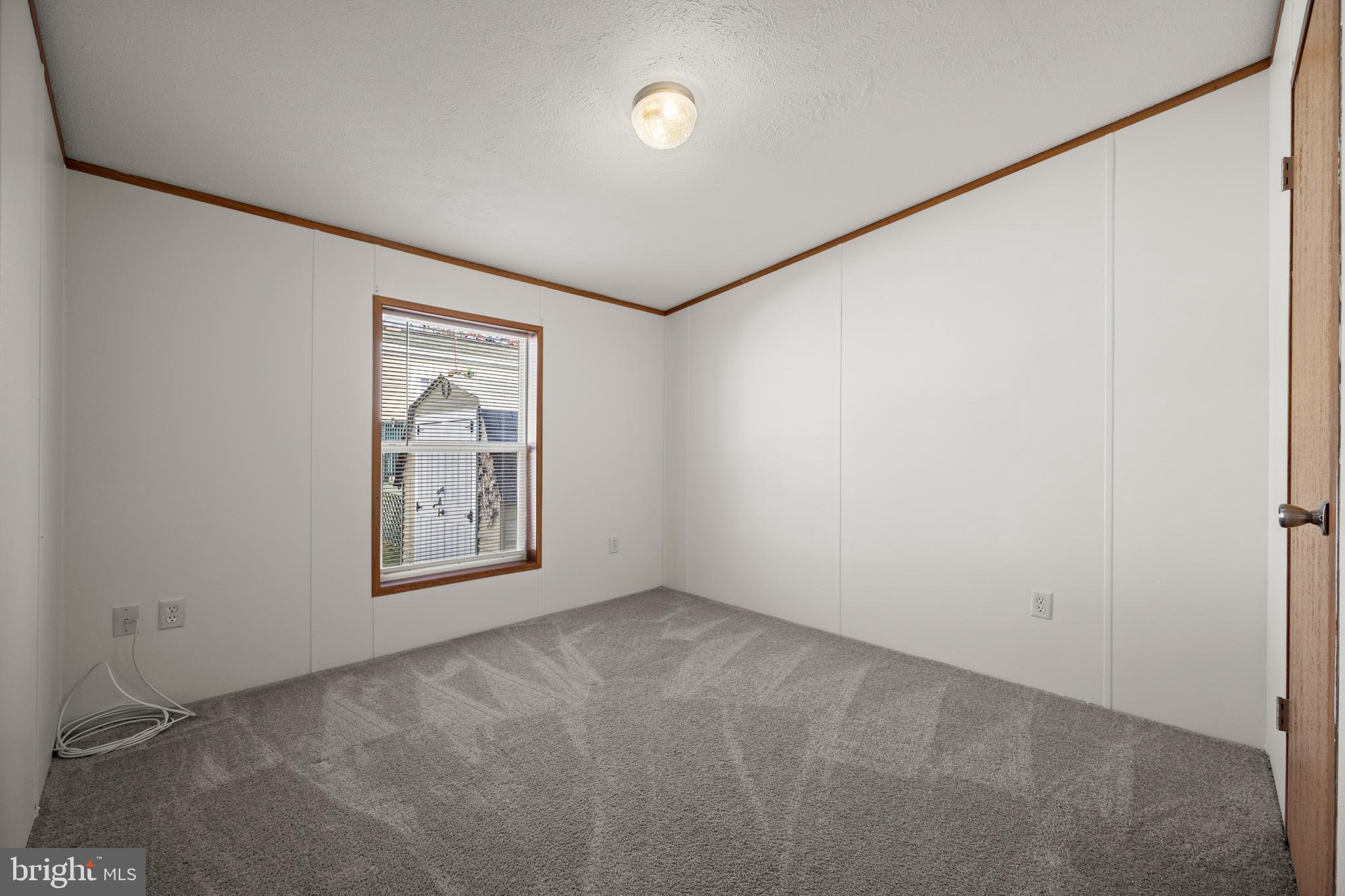 8408 Heartwood Road Jessup, MD 20794 - Photo 22 of 32 an empty room with windows