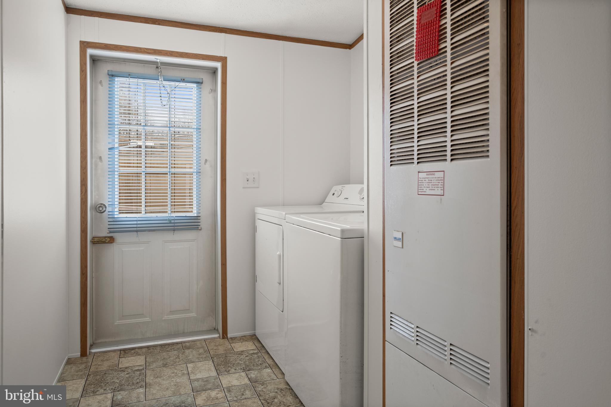 8408 Heartwood Road Jessup, MD 20794 - Photo 27 of 32 a view of bathroom and utility room