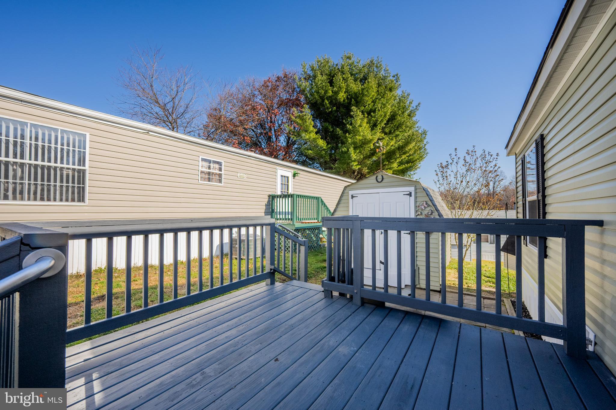 8408 Heartwood Road Jessup, MD 20794 - Photo 29 of 32 a view of a wooden balcony with a pot