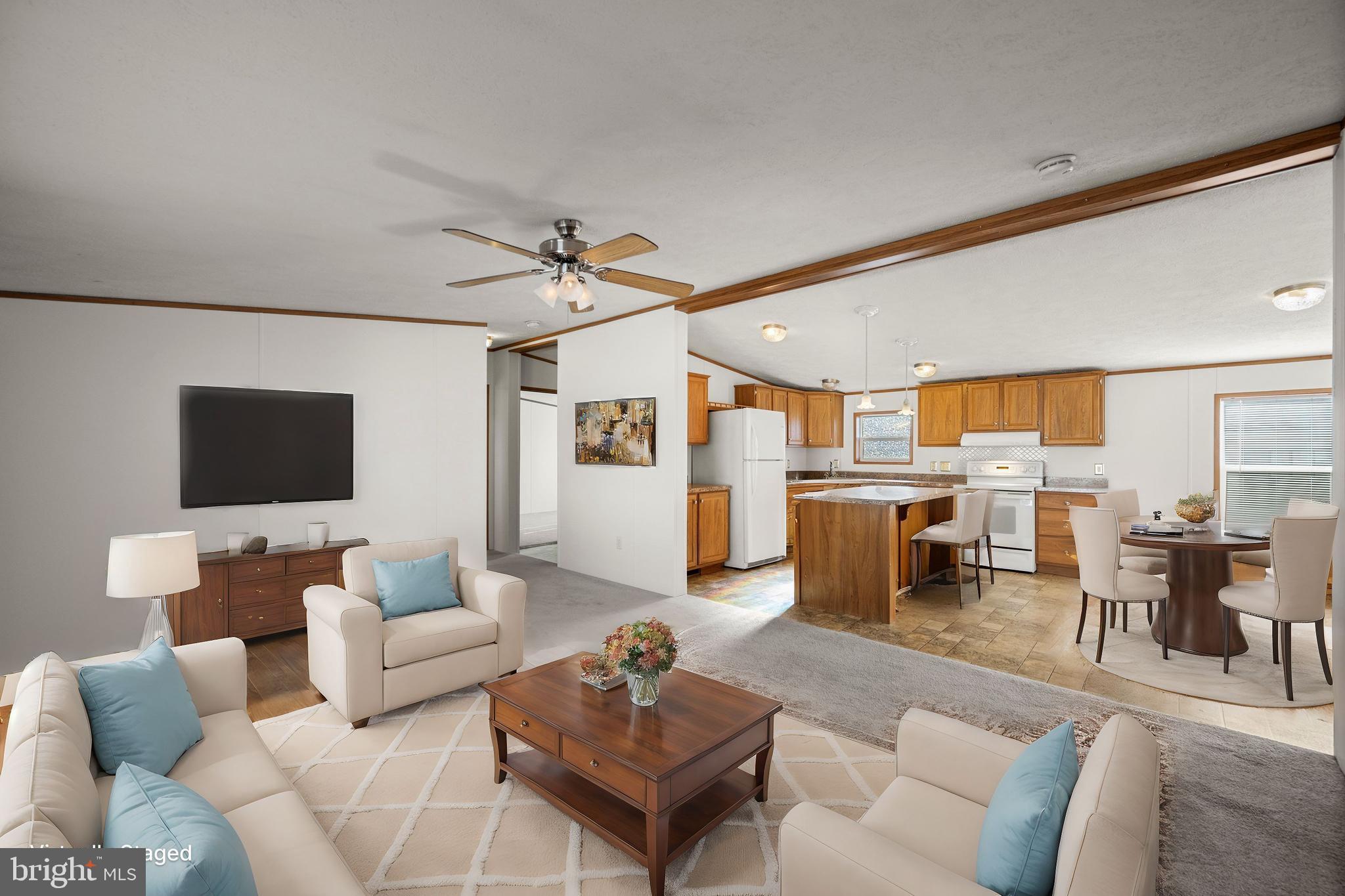 8408 Heartwood Road Jessup, MD 20794 - Photo 4 of 32 a living room with furniture and a flat screen tv