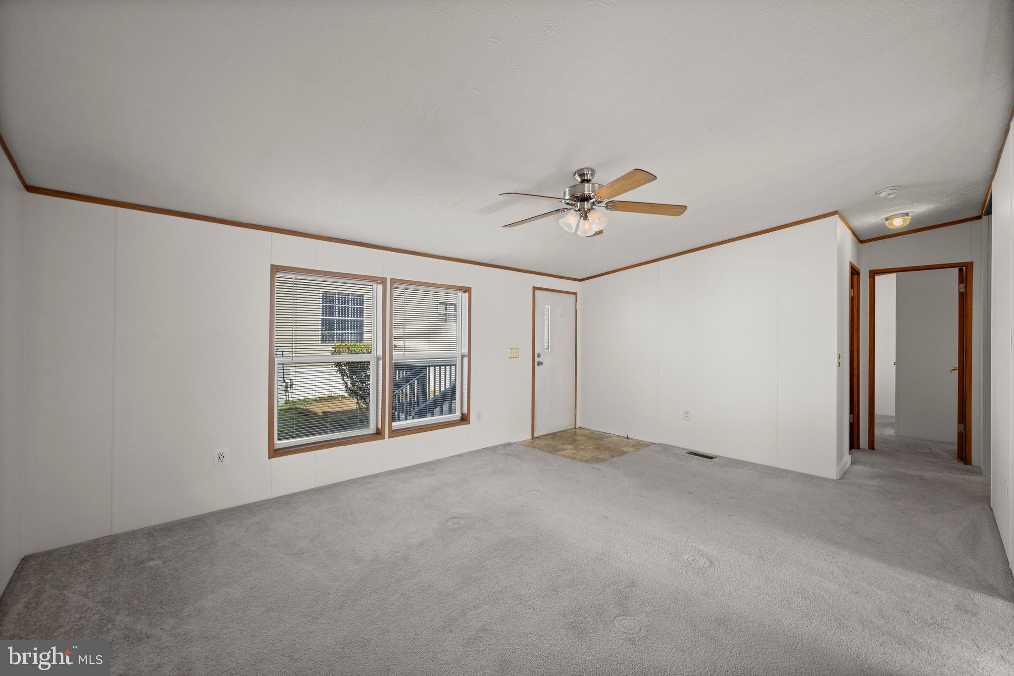 8408 Heartwood Road Jessup, MD 20794 - Photo 6 of 32 a view of an empty room with a window