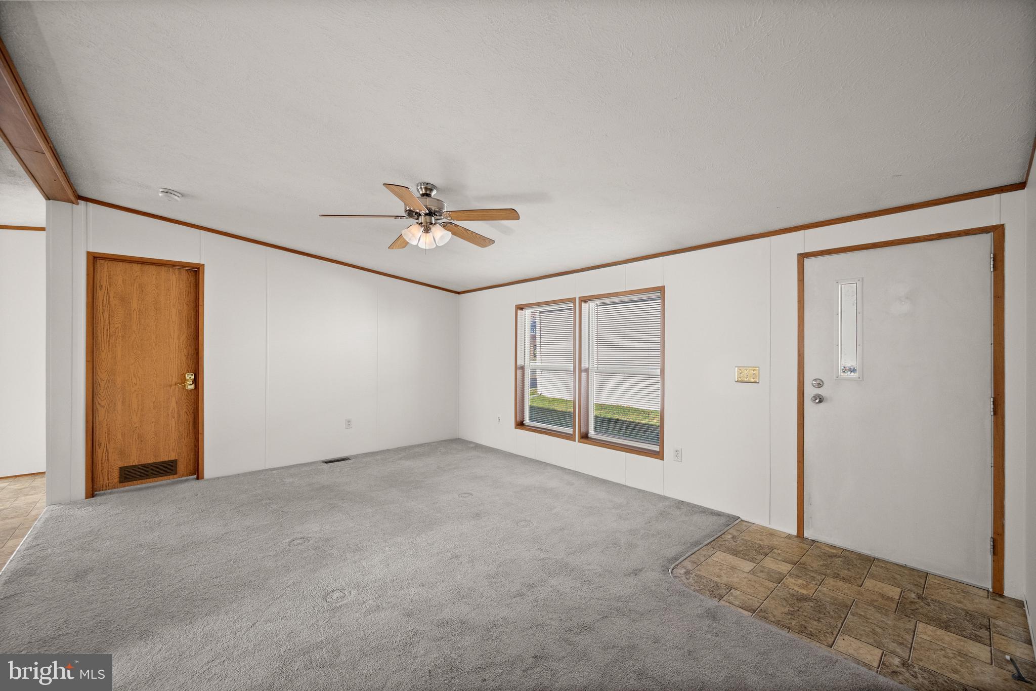 8408 Heartwood Road Jessup, MD 20794 - Photo 7 of 32 a view of an empty room with a window