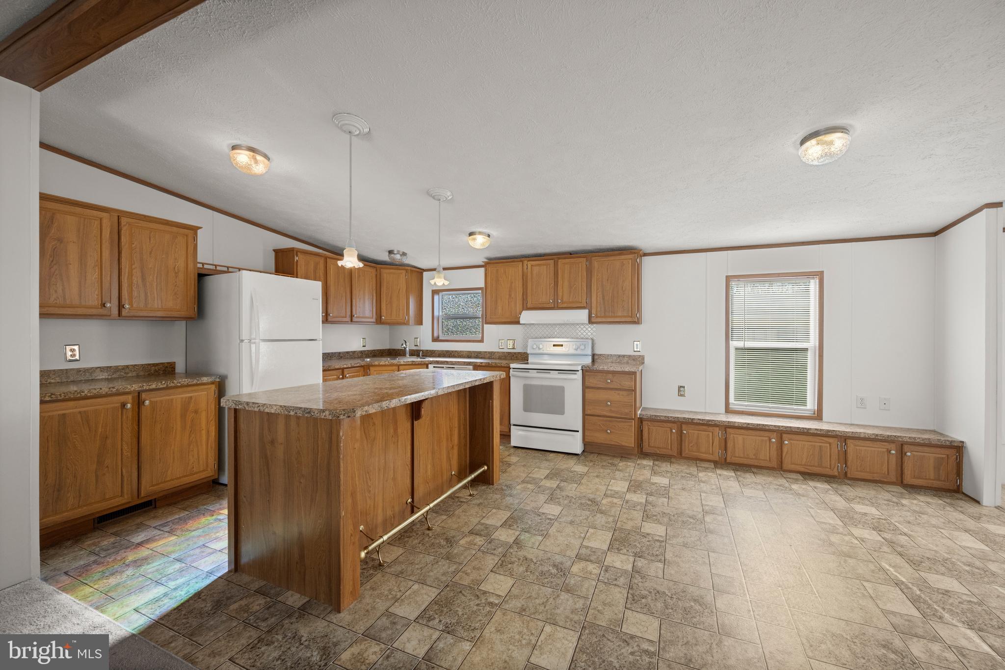 8408 Heartwood Road Jessup, MD 20794 - Photo 8 of 32 a kitchen with sink refrigerator and microwave