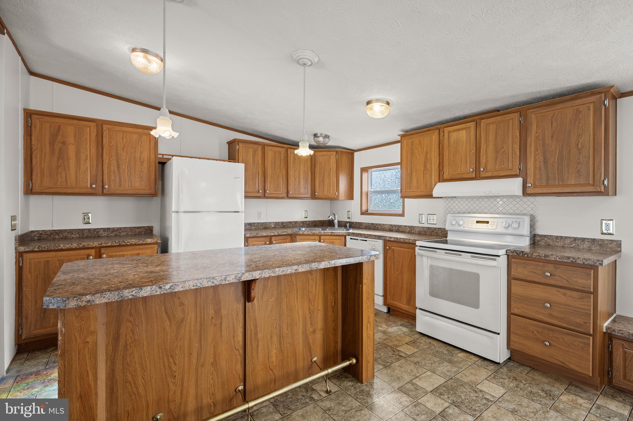 8408 Heartwood Road Jessup, MD 20794 - Photo 9 of 32 a kitchen with a sink a stove a refrigerator and cabinets
