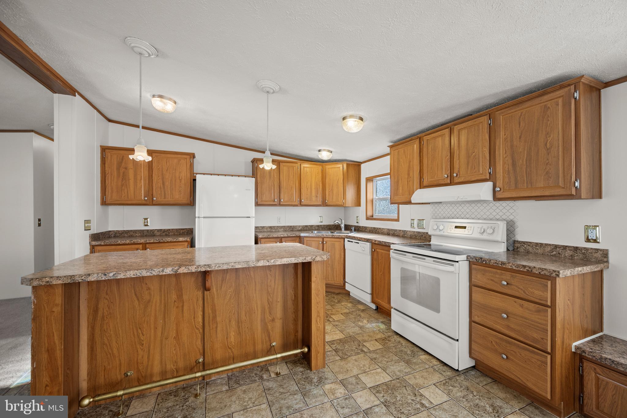8408 Heartwood Road Jessup, MD 20794 - Photo 10 of 32 a kitchen with granite countertop a sink stainless steel appliances and cabinets