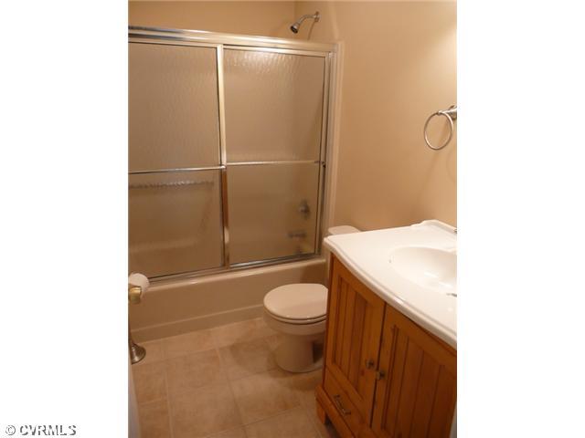 541 Enon Church Road Chester, VA 23836 - Photo 11 of 12 Interior Space/Layout - You will find 3 Full Bathrooms..no more fighting over who's in next! Notice the Nice Cabinetry, Tile flooring...Its ready for your personalization!