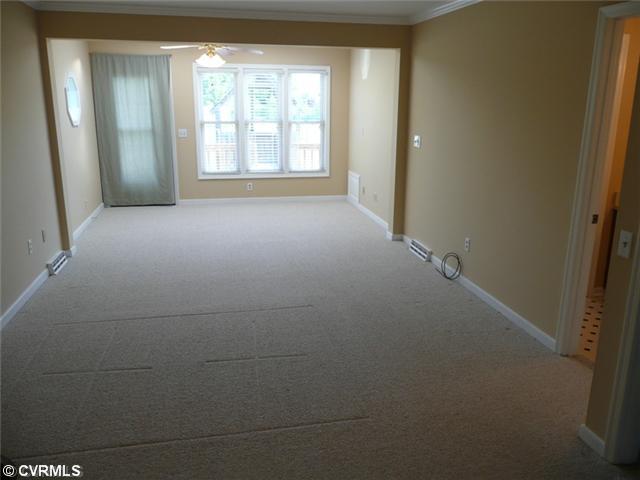 541 Enon Church Road Chester, VA 23836 - Photo 6 of 12 Master Bedroom - Huge Master Bedroom shows Bright with 3 picture windows and door that leads onto deck overlooking backyard. You will also find a Cedar-Lined Walk-in closet and attached Bath.