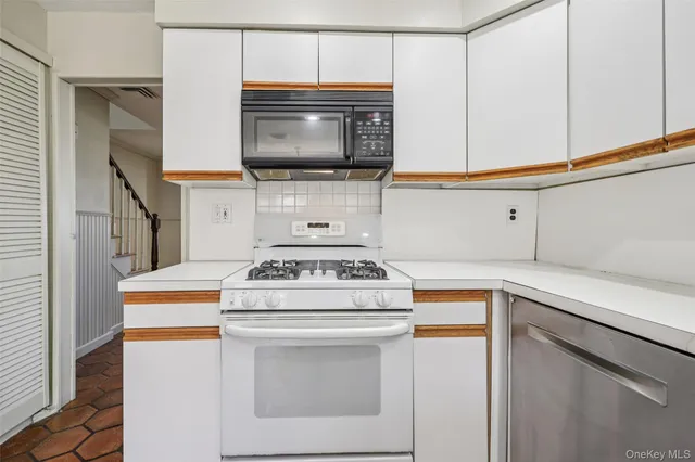 a kitchen with a stove and a microwave