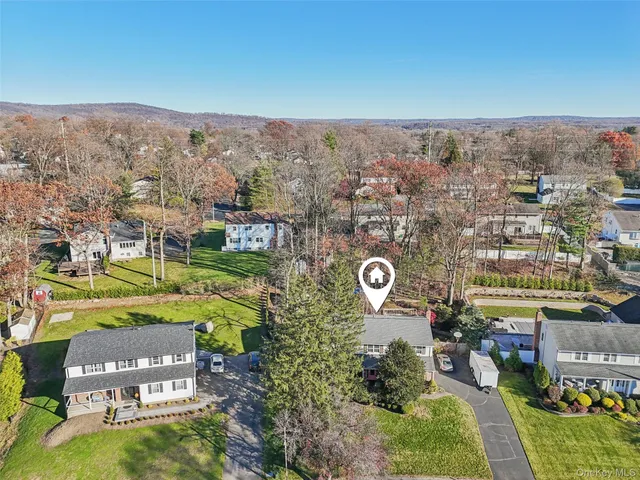 an aerial view of a house with a outdoor space