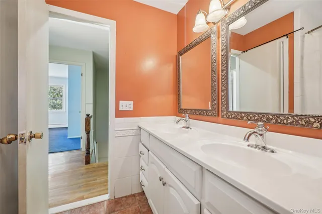 a bathroom with a sink and a mirror
