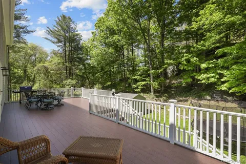 a view of backyard with furniture and trees