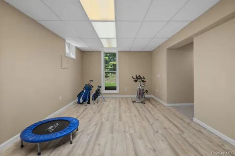 a view of a room with wooden floor and exposed radiator