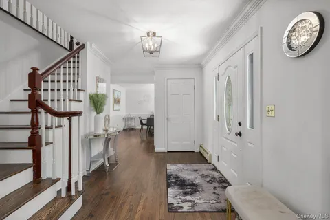 a view of entryway with wooden floor
