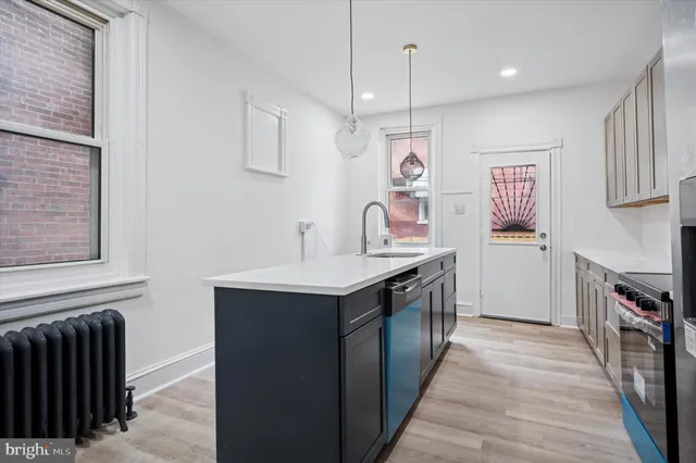 a kitchen with a stove and a refrigerator
