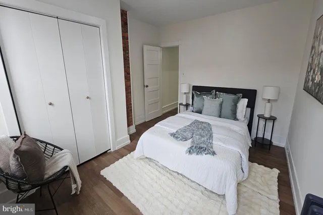 a bedroom with a bed and cabinets