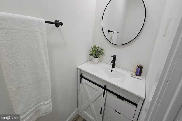 a bathroom with a sink and mirror