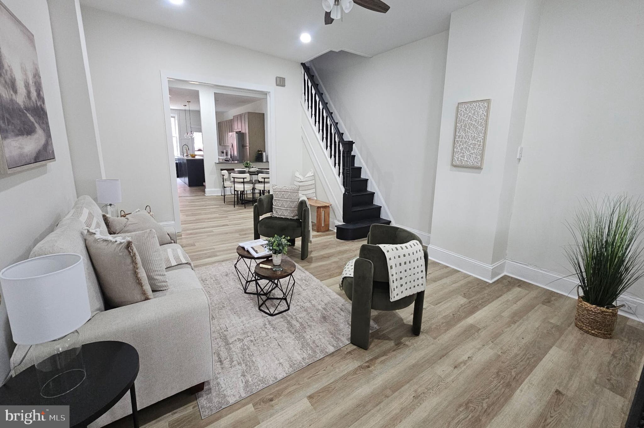 5457 Cedar Avenue Philadelphia, PA 19143 - Photo 5 of 29 a living room with furniture and wooden floor