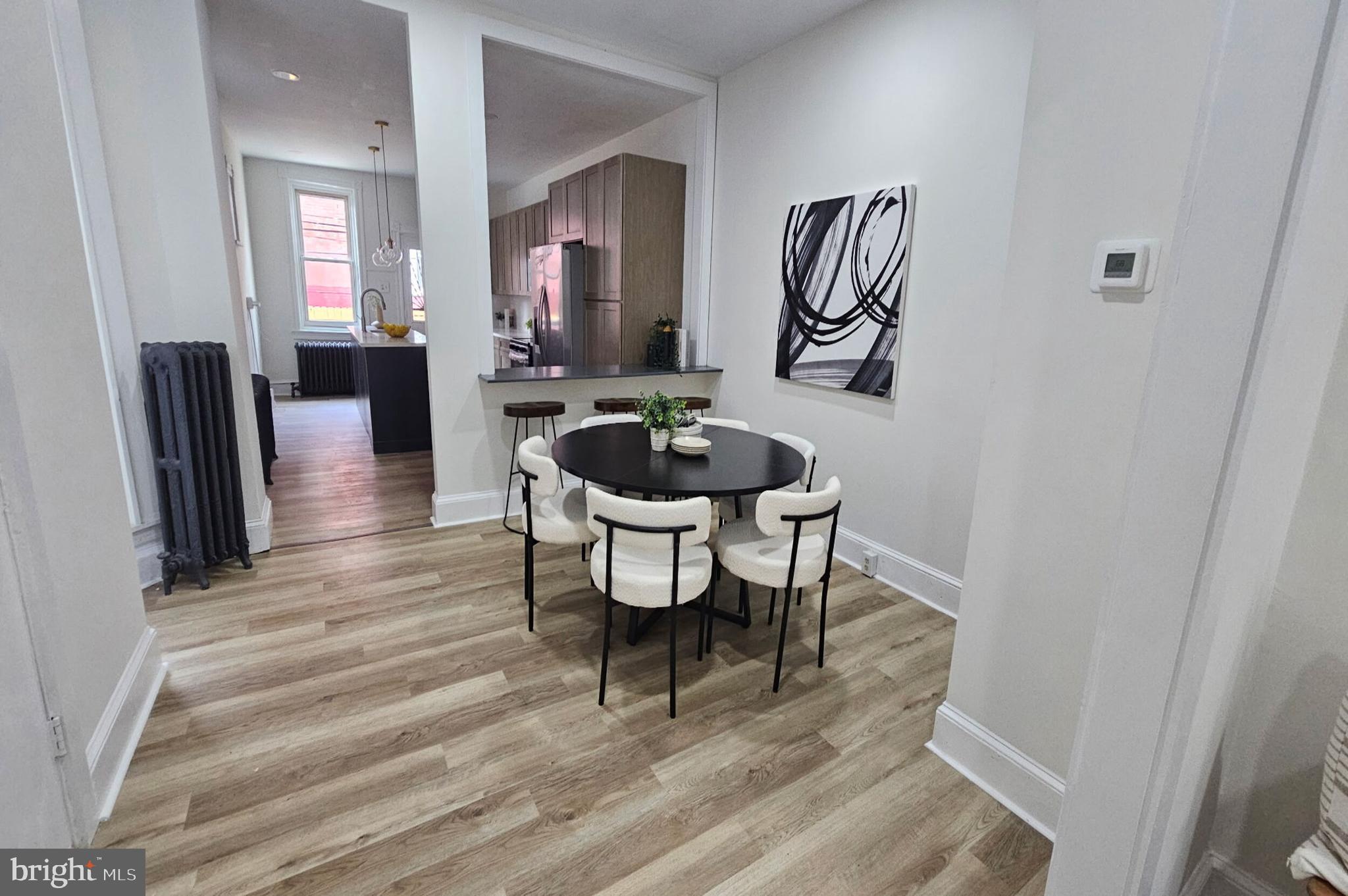 5457 Cedar Avenue Philadelphia, PA 19143 - Photo 8 of 29 a dining room with furniture and wooden floor