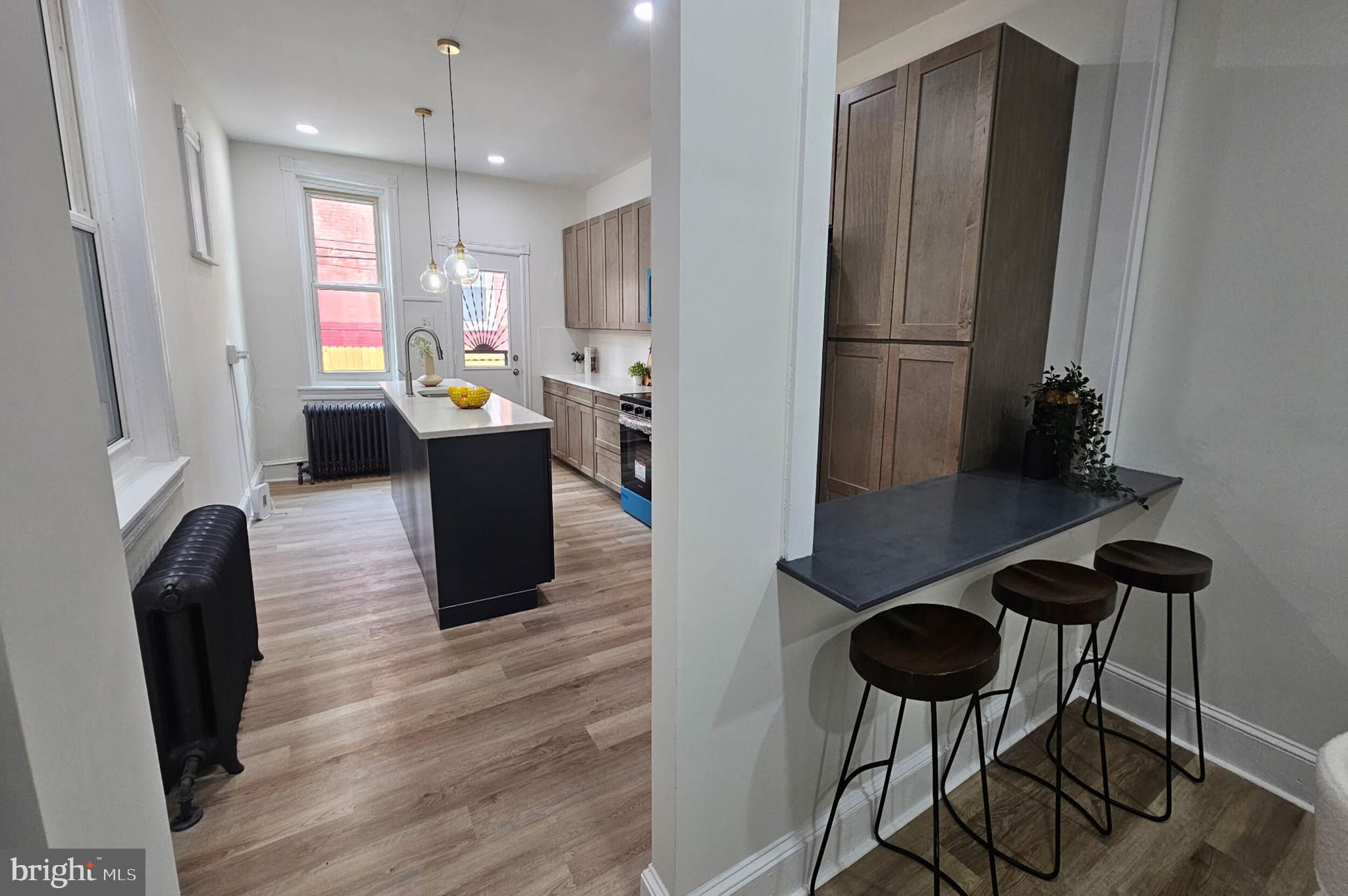 5457 Cedar Avenue Philadelphia, PA 19143 - Photo 9 of 29 a view of kitchen with furniture and a refrigerator