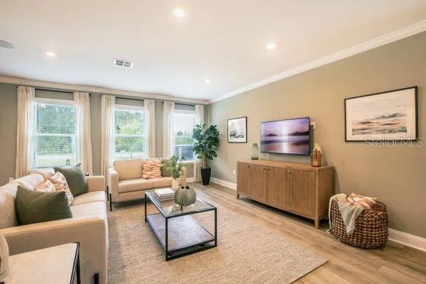 a living room with furniture and a window