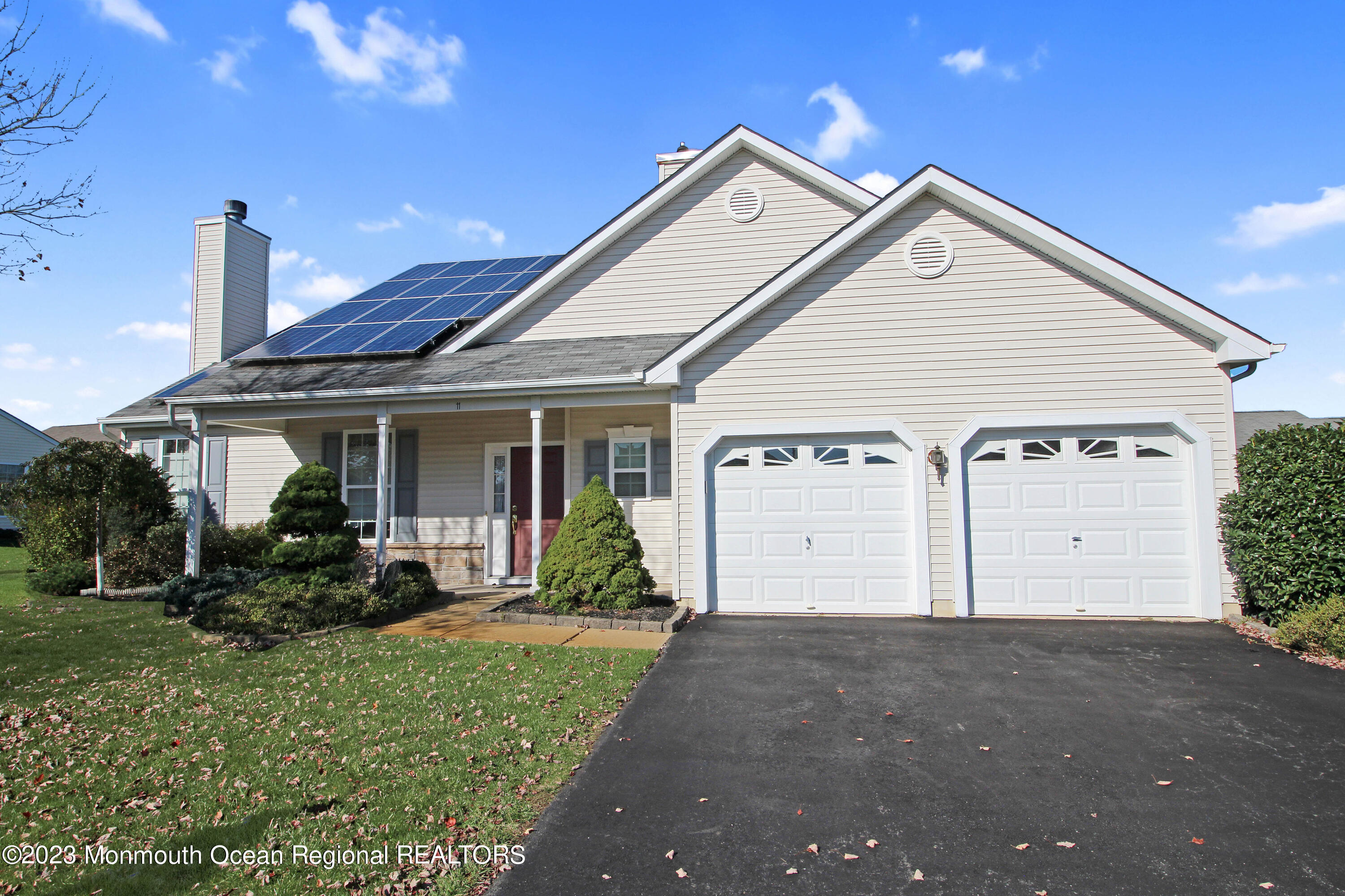 11 Carriage Road Whiting, NJ 08759 - Photo 1 of 35 a front view of a house with a yard and garage