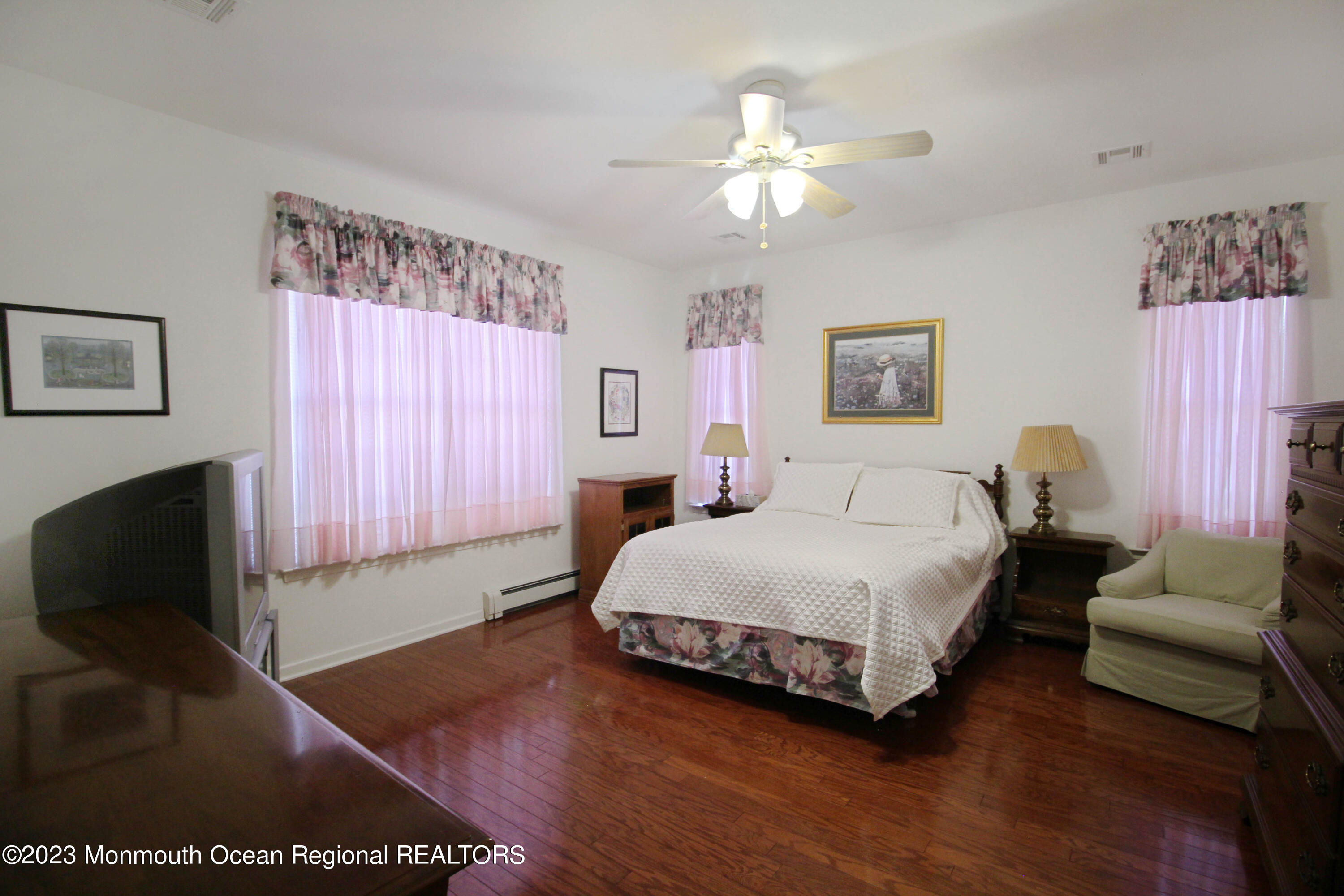 11 Carriage Road Whiting, NJ 08759 - Photo 20 of 35 a spacious bedroom with a bed and a couch