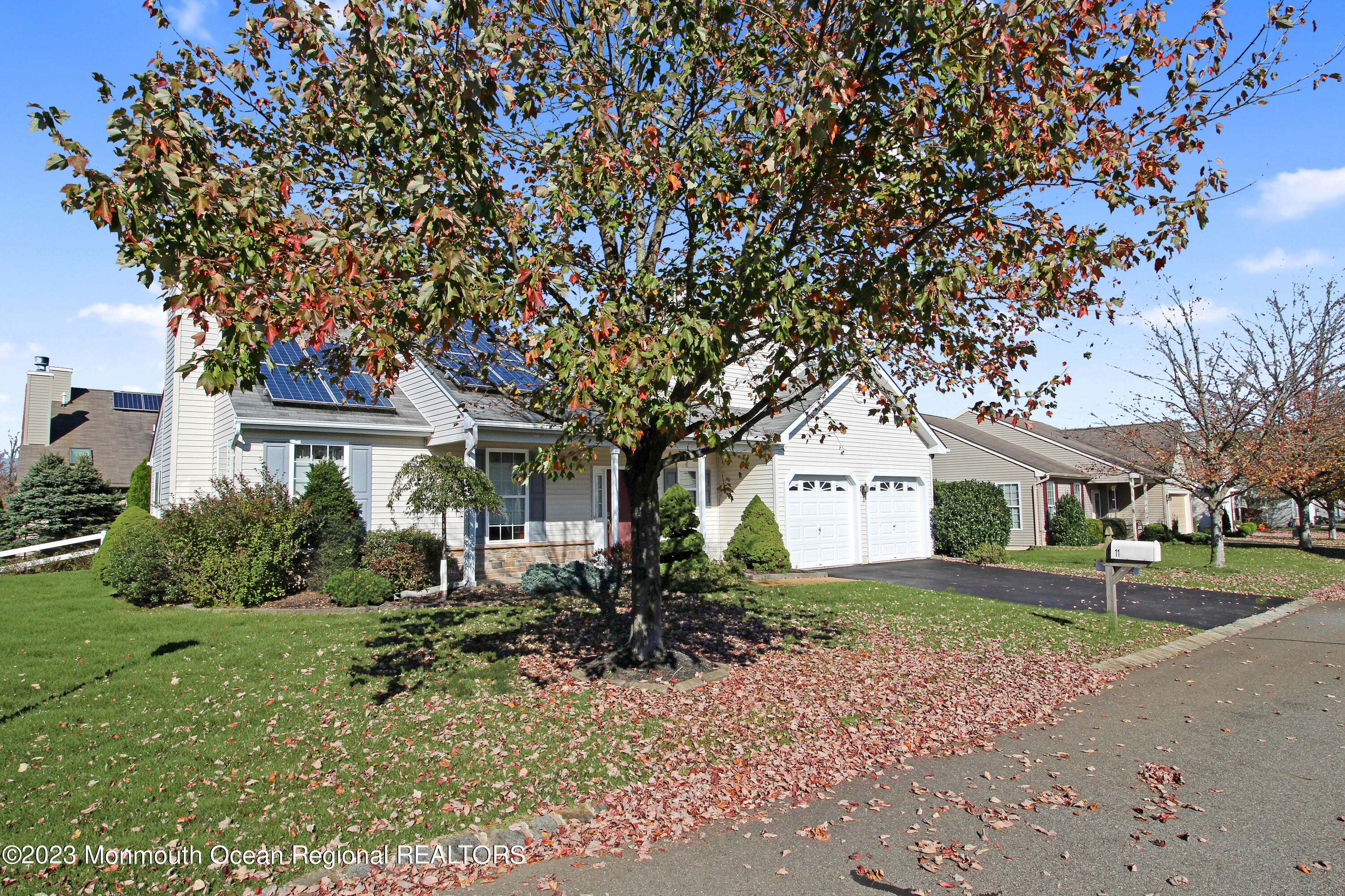 11 Carriage Road Whiting, NJ 08759 - Photo 2 of 35 a front view of a house with a garden