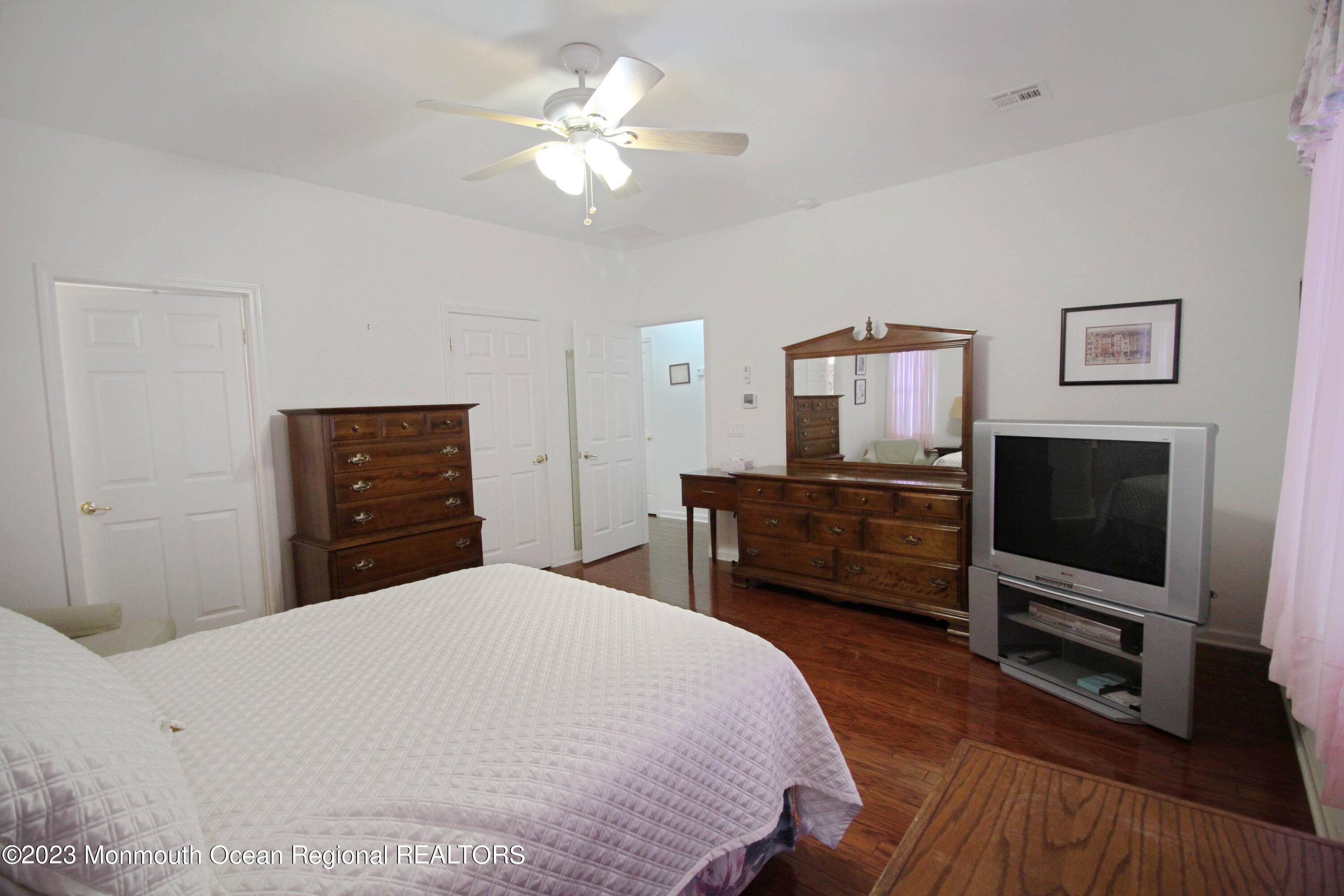 11 Carriage Road Whiting, NJ 08759 - Photo 22 of 35 a bedroom with a bed and a flat screen tv