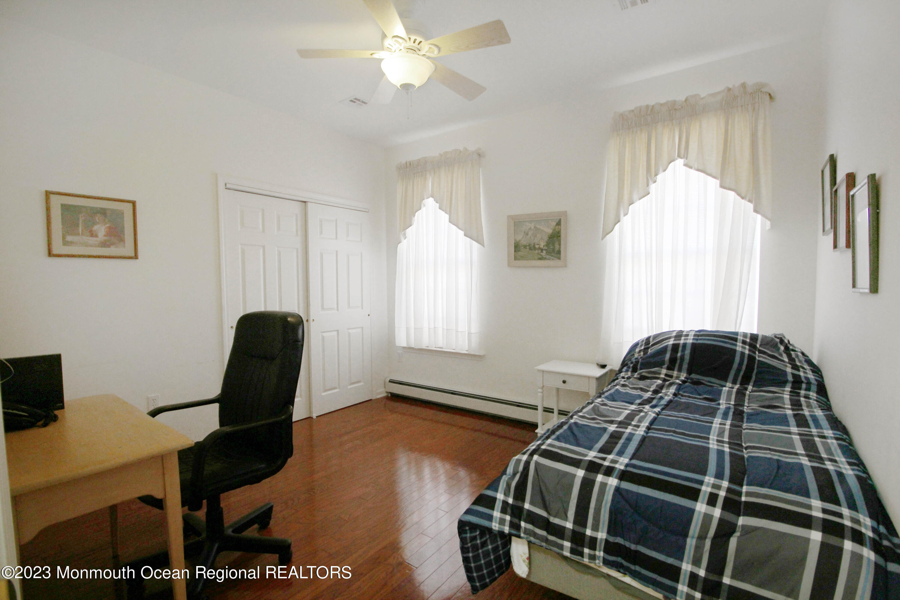 11 Carriage Road Whiting, NJ 08759 - Photo 25 of 35 a bedroom with a bed and a chandelier