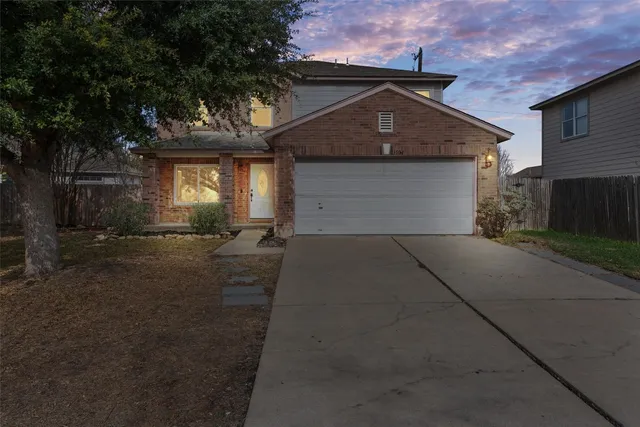 a front view of a house with yard