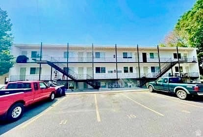 640 East 600 North Logan, UT 84321 - Photo 1 of 20 View of apartment building / complex featuring stairway and uncovered parking