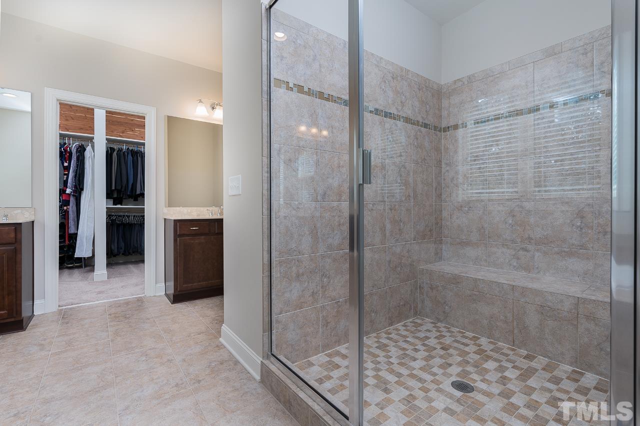 4813 Sunset Fairways Drive Apex, NC 27539 - Photo 25 of 44 a bathroom with a shower and a sink