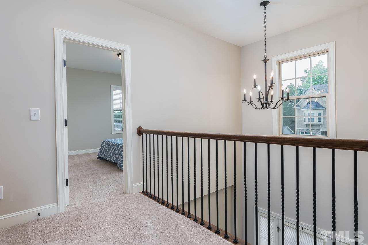 4813 Sunset Fairways Drive Apex, NC 27539 - Photo 30 of 44 a view of a hallway with a window