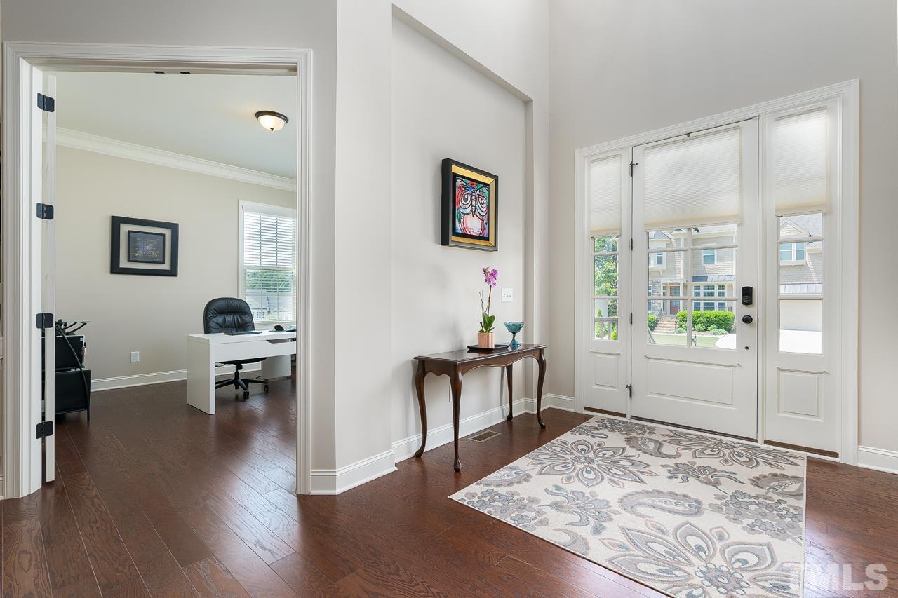 4813 Sunset Fairways Drive Apex, NC 27539 - Photo 7 of 44 a living room with furniture and a table