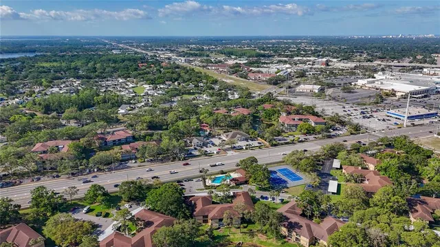 an aerial view of a city and ocean view
