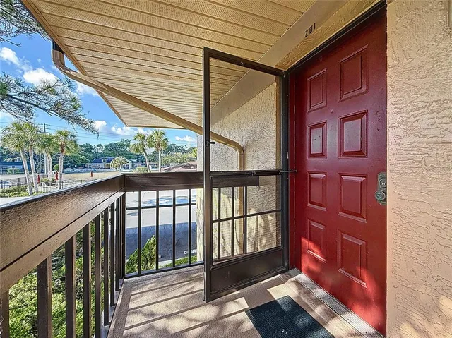 a view of balcony with wooden floor
