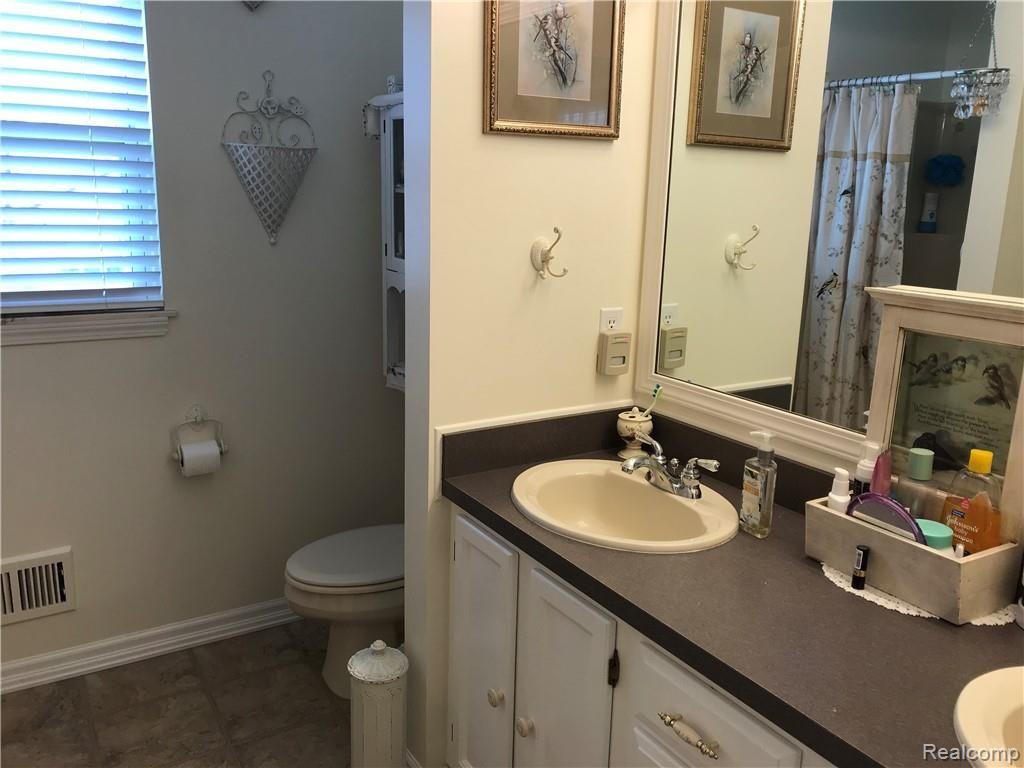 2554 Crooked Lake Road Howell, MI 48843 - Photo 19 of 44 Master bath with two sinks, shower and jetted tub.